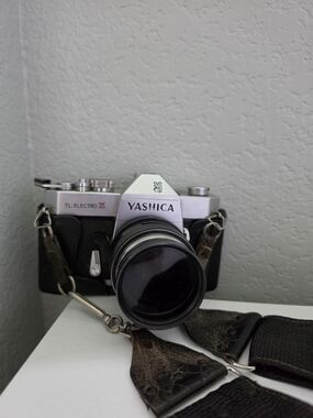 Yashica TL Electro X 35mm Camera in Black and Silver with Leather Strap
